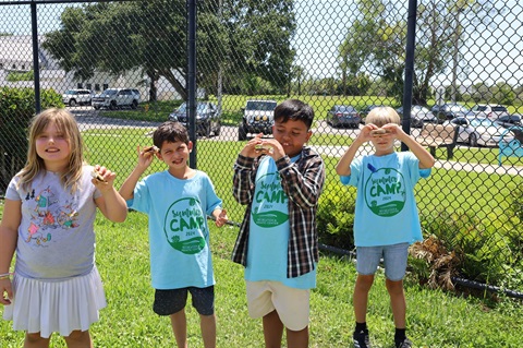 Kids holding up smores