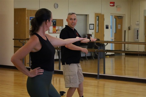 Fencing instructor and student