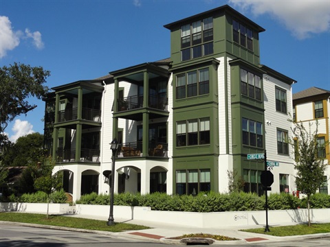 white 3 story apartment building