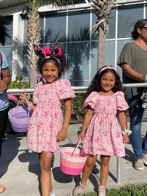 Two girls dressed in pink easter dresses